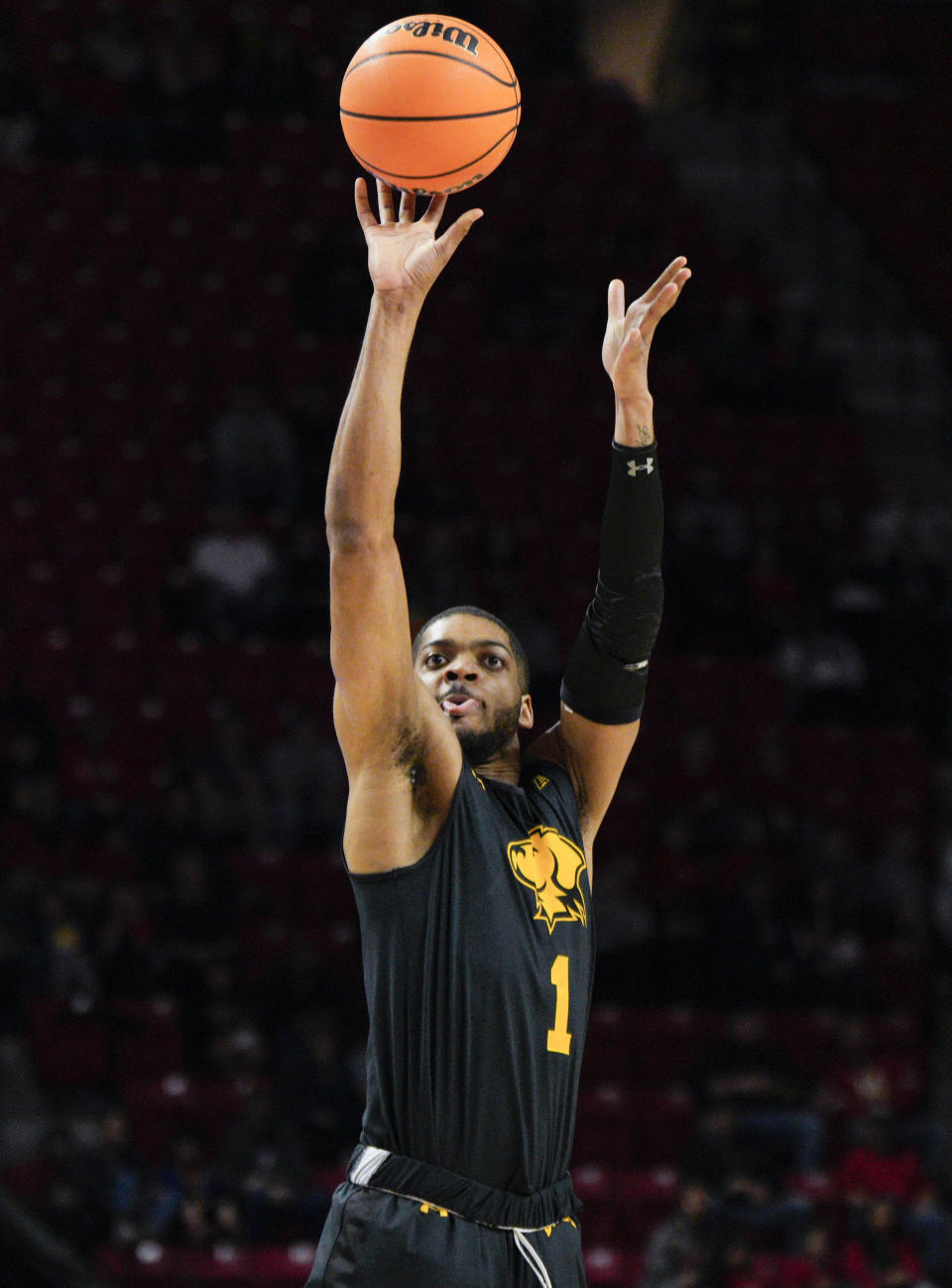UMBC forward Jarvis Doles (1) shoots against Maryland during the first half of an NCAA college basketball game Thursday, Dec. 29, 2022, in College Park, Md. (AP Photo/Jess Rapfogel)