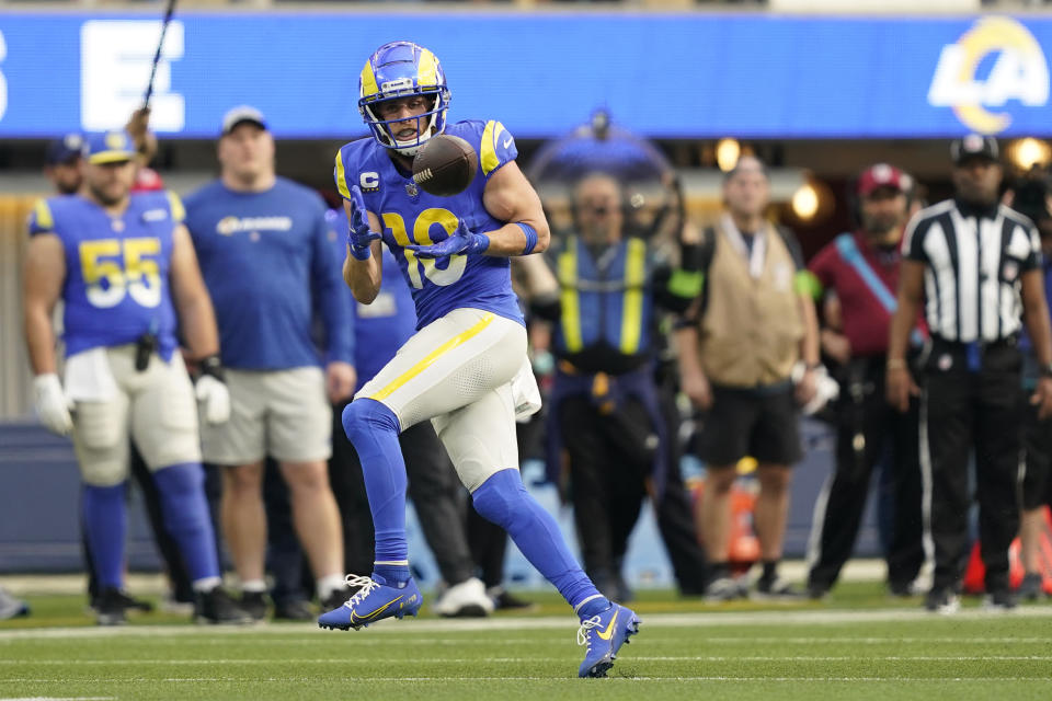 Los Angeles Rams wide receiver Cooper Kupp (10) makes a catch for a first down during the first half of an NFL football game against the Washington Commanders Sunday, Dec. 17, 2023, in Los Angeles. (AP Photo/Ryan Sun)