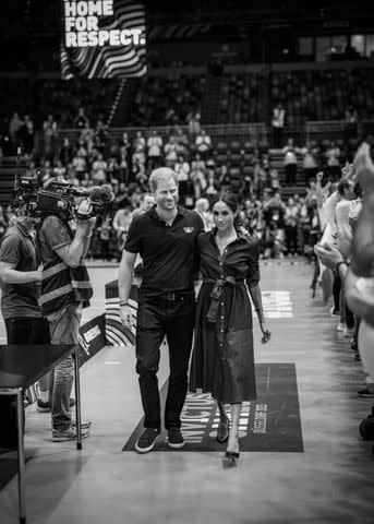 <p>Misan Harriman</p> Prince Harry and Meghan Markle at the Invictus Games in Sept. 2023