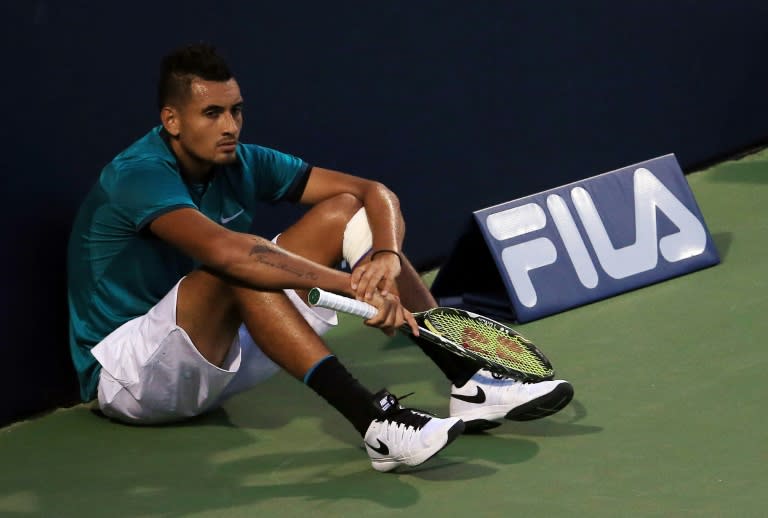 Nick Kyrgios of Australia sits at the end of the court ahead of the final game in his match against Denis Shapovalov of Canada, during the Rogers Cup, at the Aviva Centre in Toronto, Ontario, on July 25, 2016