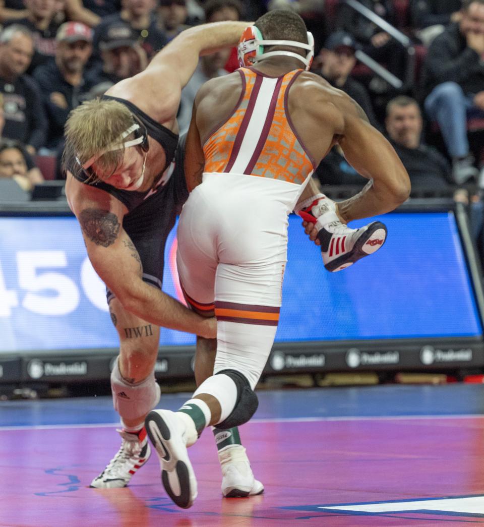 Virginia Tech's Mekhi Lewis (right), shown wrestling Rutgers' Jackson Turley on Nov. 17, is the No. 1 seed in a top heavy 174-pound bracket in the NCAA Division 1 Wrestling Tournament.