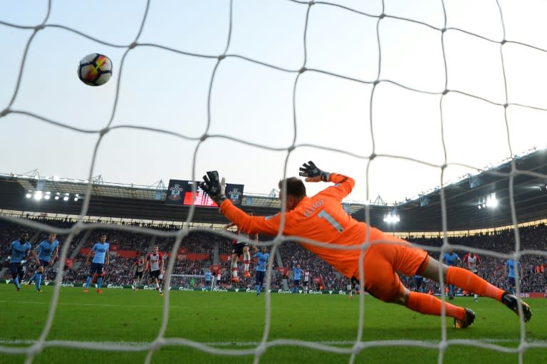 Southampton's striker Manolo Gabbiadini scores their second goal from the penalty spot during the English Premier League football match between against Newcastle United October 15, 2017