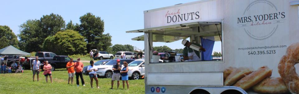 Fans patiently wait in line for Mrs. Yoder's Kitchen sourdough donuts during Richlands Dairy and Creamery's anniversary event held in Dinwiddie on June 27, 2020.