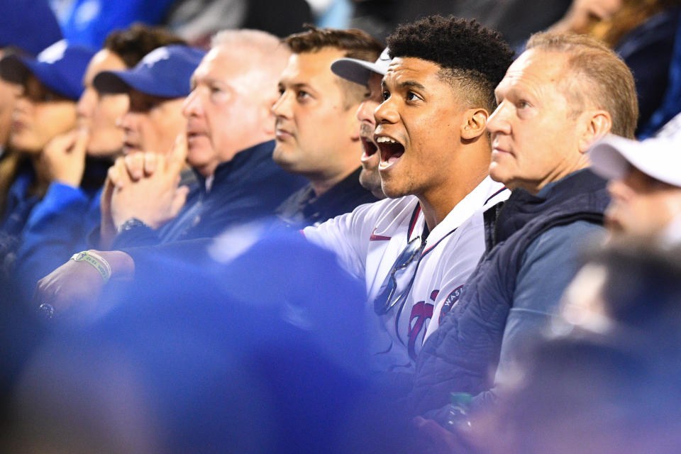 LOS ANGELES, CA - OCTOBER 06: Agent Scott Boras sits with Washington Nationals Juan Soto, who was wearing a Trea Turner Nationals jersey, cheers in the stands during the MLB National League Wild Card game between the St. Louis Cardinals and the Los Angeles Dodgers on October 6, 2021 at Dodger Stadium in Los Angeles, CA. (Photo by Brian Rothmuller/Icon Sportswire via Getty Images)