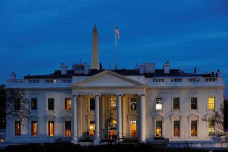 Security personnel walk on the roof of then White House near Pennsylvania Avenue before Inauguration Day for U.S. President-elect Donald Trump in Washington, U.S., January 20, 2017. REUTERS/Lucas Jackson