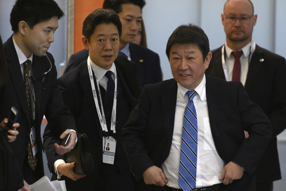 Japan's Foreign Minister Toshimitsu Motegi, second right, arrives at a trilateral meeting with US Secretary of State and South Korea's Foreign Minister during the 56th Munich Security Conference (MSC) in Munich, southern Germany Saturday, Feb. 15, 2020. (Andrew Caballero-Reynolds/Pool Photo via AP)