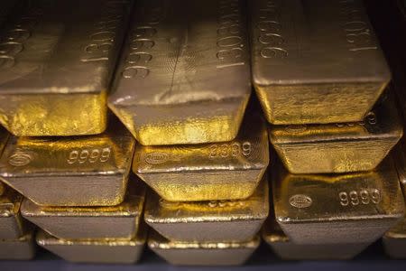 Gold prices fell on a stronger dollar on Thursday