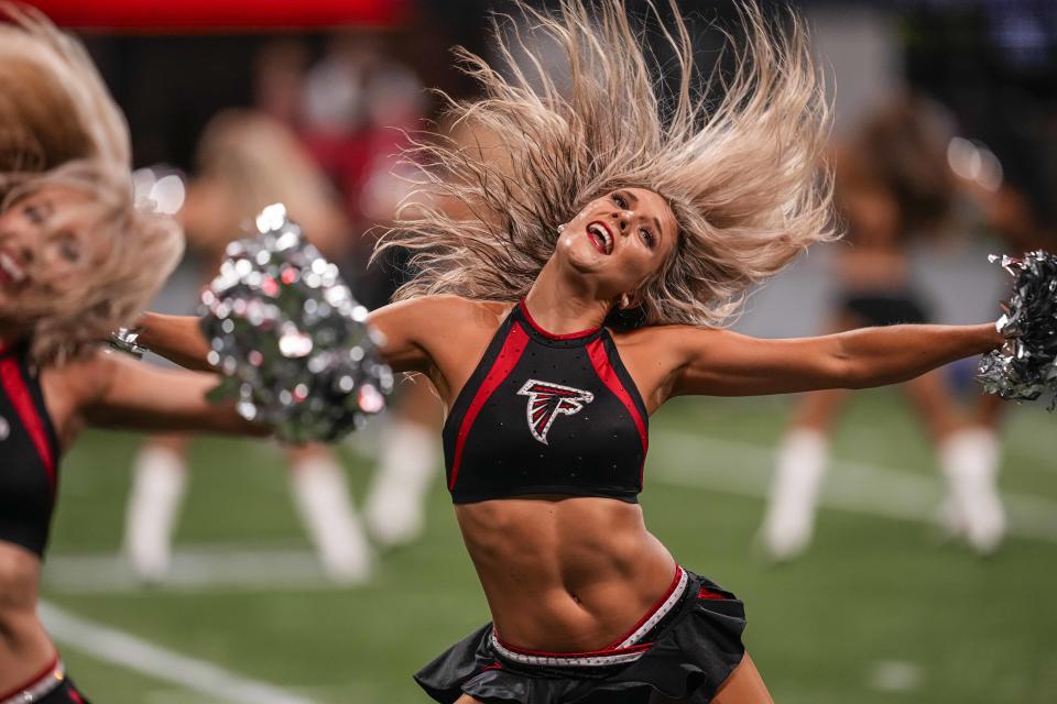 Aug 18, 2023; Atlanta, Georgia, USA; An Atlanta Falcons cheerleader performs during the game against the Cincinnati Bengals during the second half at Mercedes-Benz Stadium. Mandatory Credit: Dale Zanine-USA TODAY Sports