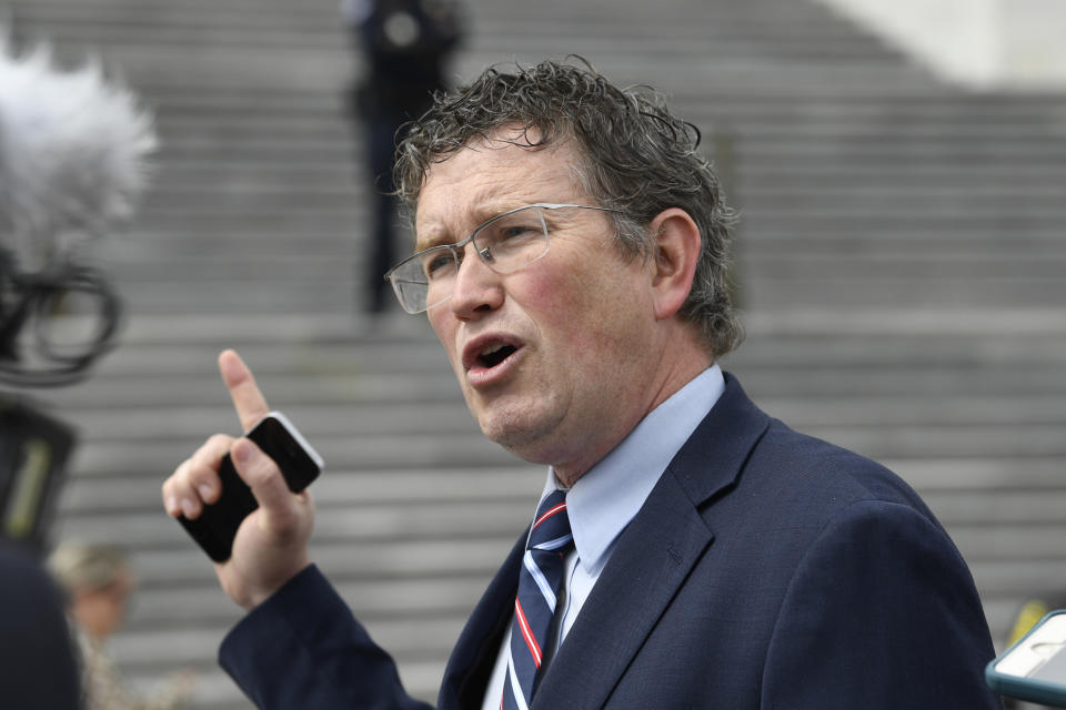 Rep. Thomas Massie, R-Ky., talks to reporters before leaving Capitol Hill in Washington, Friday, March 27, 2020, after attempting to slow action on a rescue package. Despite Massie's effort, the House, acting with exceptional resolve in an extraordinary time, rushed President Donald Trump a $2.2 trillion rescue package, tossing a life preserver to a U.S. economy and health care system left flailing by the coronavirus pandemic. (AP Photo/Susan Walsh)