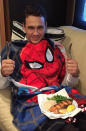 The perfect way to keep your outfit clean while couch dining? A Spidey towel-turned-bib, of course.