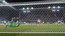 Tottenham's Harry Kane, centre, scores his team's second goal from the penalty spot during the English Premier League soccer match between Aston Villa and Tottenham Hotspur at Villa Park in Birmingham, England, Sunday, March 21, 2021. (AP Photo/Tim Keeton,Pool)