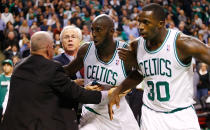 BOSTON, MA - NOVEMBER 28: Kevin Garnett #5 and Brandon Bass #30 of the Boston Celtics are held back by coaches during a fight with members of the Brooklyn Nets during the game on November 28, 2012 at TD Garden in Boston, Massachusetts.