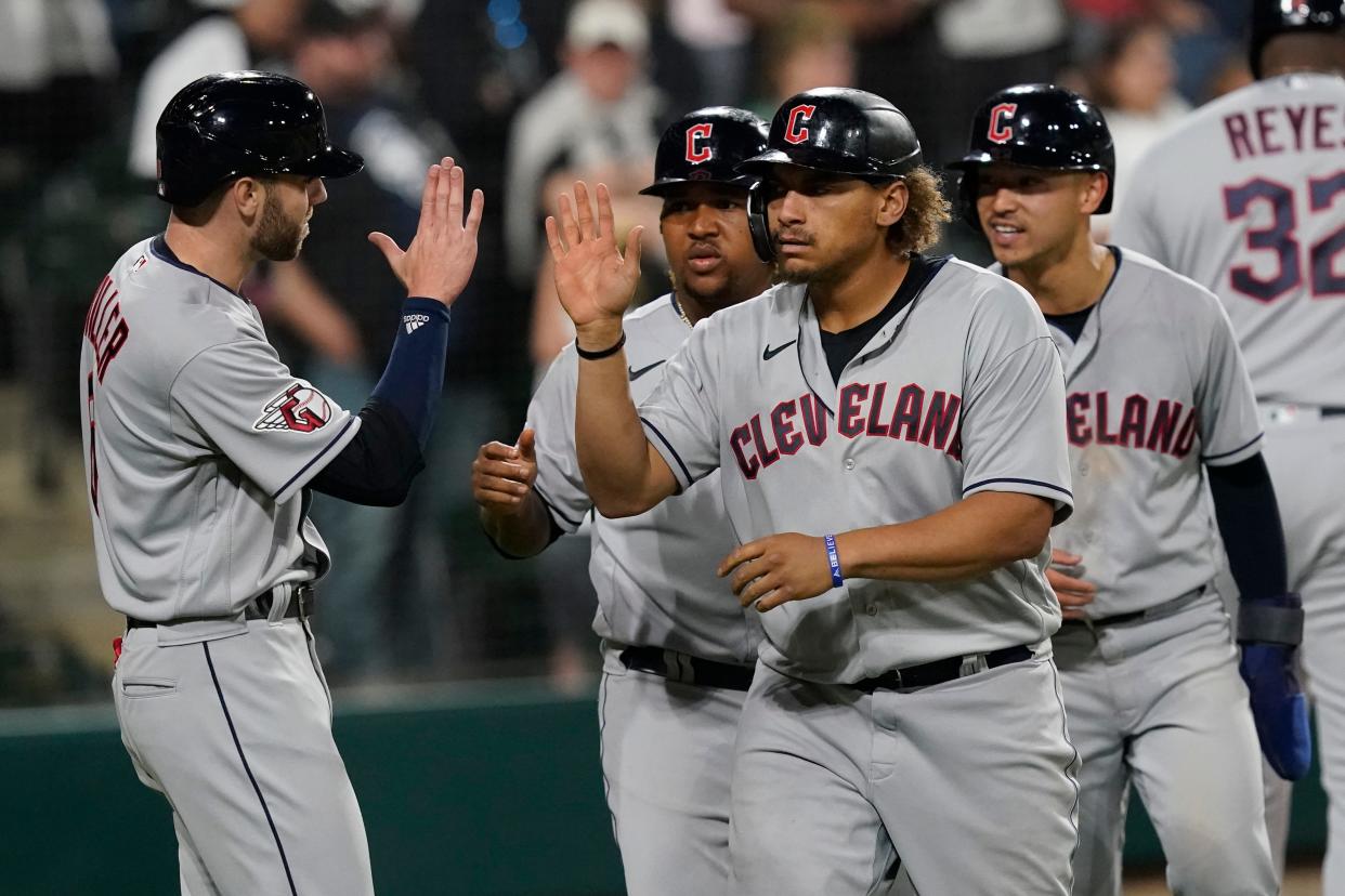 Outfielder Josh Naylor, center, has been both an offensive force and an emotional leader for the Guardians. [Charles Rex Arbogast/Associated Press]