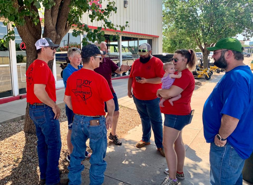 Joy VFD members, family members and other volunteers are seen.