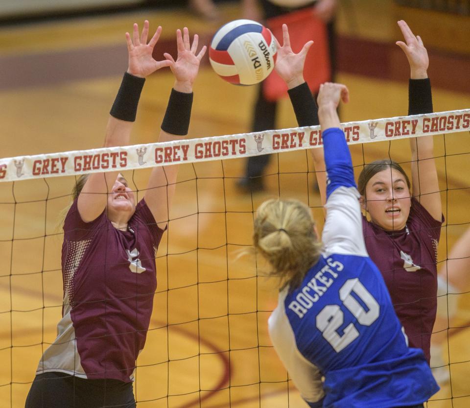 IVC's Ali Bainter, left, and Kylie McMorrow, far right, try to block a spike from Limestone's Kennedy Barber during their match Wednesday, Aug. 31, 2022 in Chillicothe.