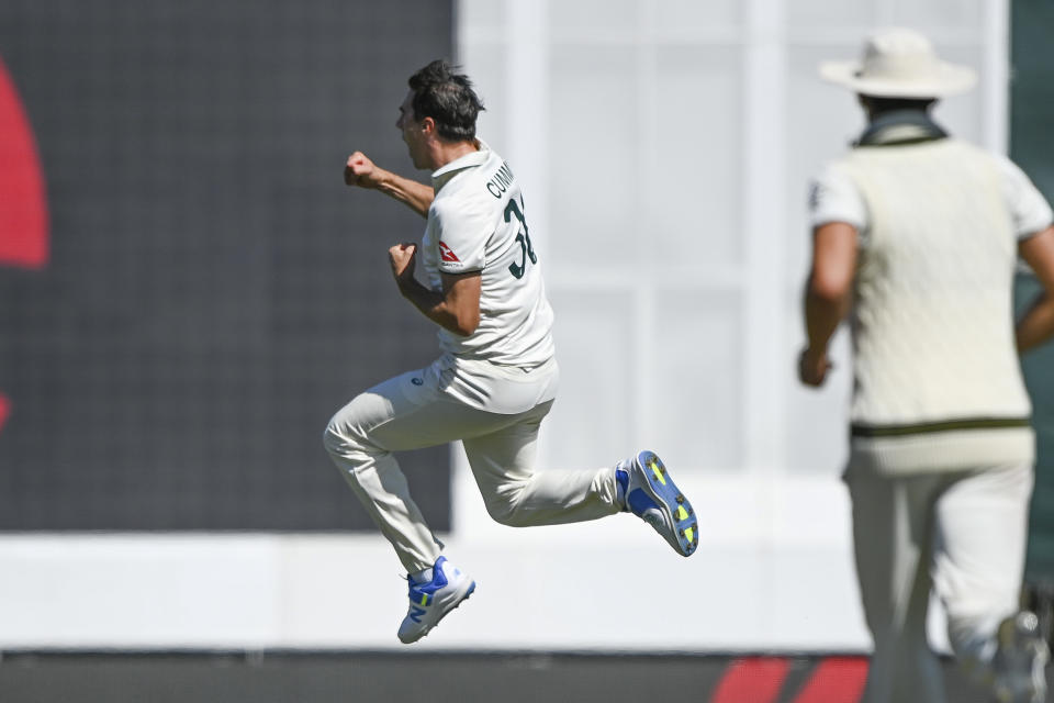 Australia's Pat Cummins celebrates the wicket of New Zealand's Rachin Ravindr on day three of the second cricket test between New Zealand and Australia in Christchurch, New Zealand, Sunday, March 10, 2024. (John Davidson/Photosport via AP)