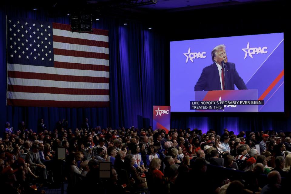 Guests listen to former President Donald Trump address the Conservative Political Action Conference as the headline speaker. <a href="https://media.gettyimages.com/id/1471305270/photo/conservatives-attend-the-annual-cpac-event.jpg?s=1024x1024&w=gi&k=20&c=zWagq1ThWllJ7ms-NvFBPVyIE6AzjqBrGbbX1osO7b4=" rel="nofollow noopener" target="_blank" data-ylk="slk:Anna Moneymaker/Getty Images;elm:context_link;itc:0;sec:content-canvas" class="link ">Anna Moneymaker/Getty Images</a>
