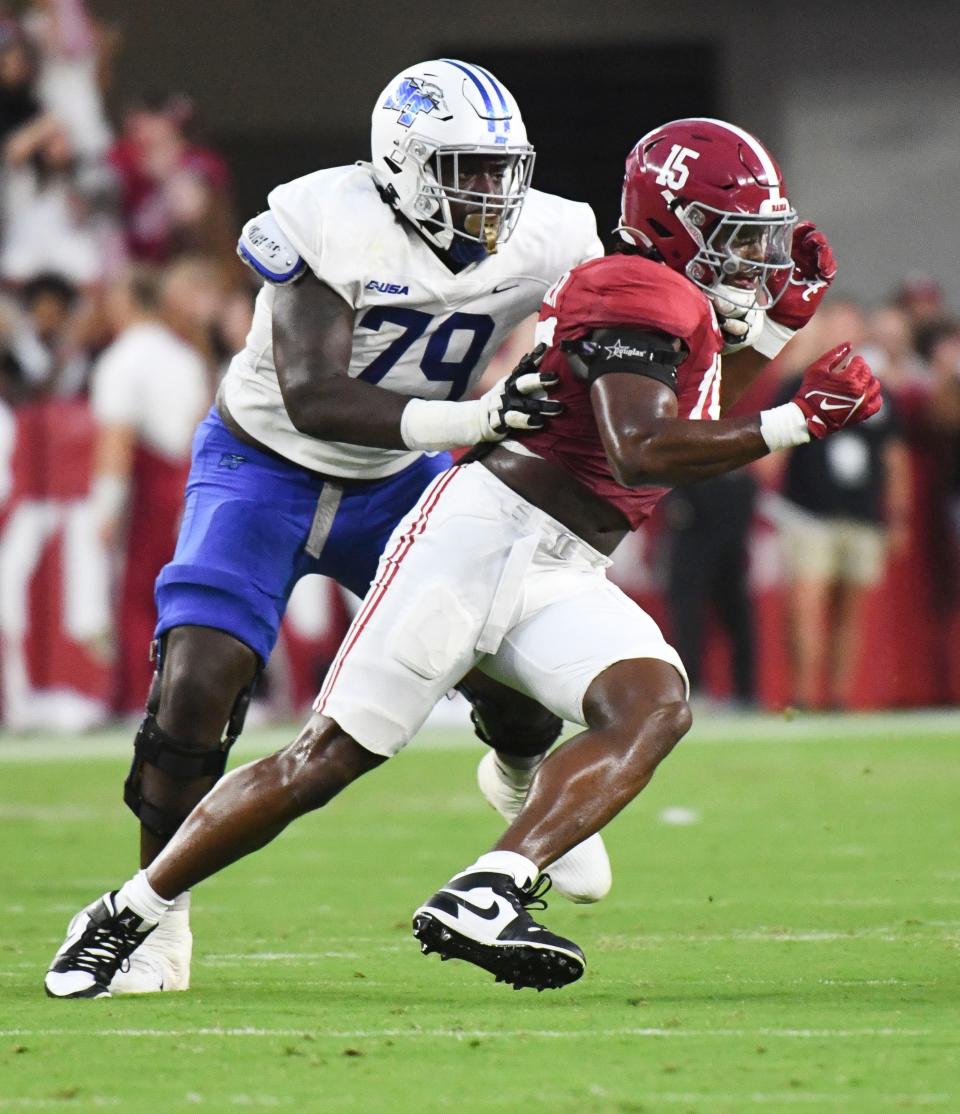 Middle Tennessee State offensive tackle Sterling Porcher (79) blocks Alabama linebacker Dallas Turner during a September game this season. Porcher announced Tuesday he plans to transfer to Texas Tech.