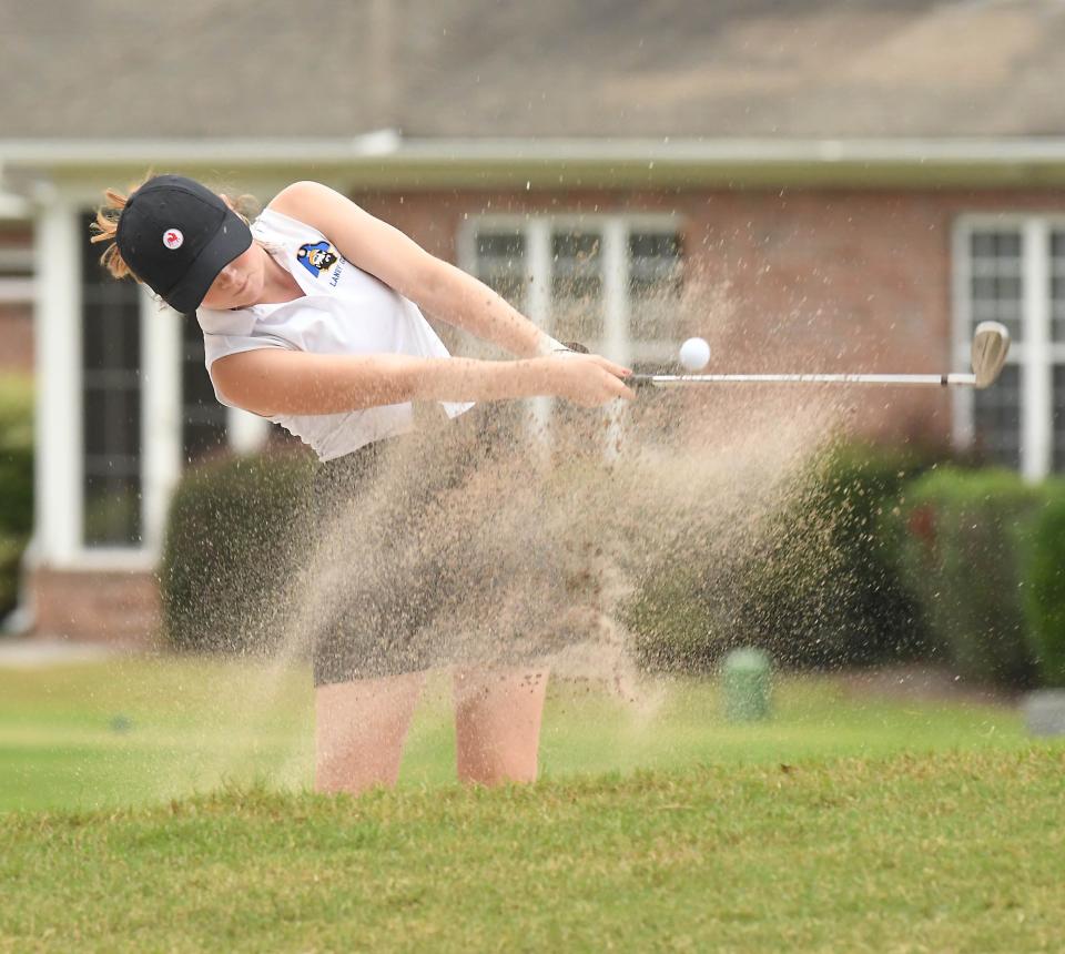 Haley Goldberg comes out of the sand on the 15th hole at Magnolia Greens in Leland, N.C. [KEN BLEVINS/STARNEWS] 
