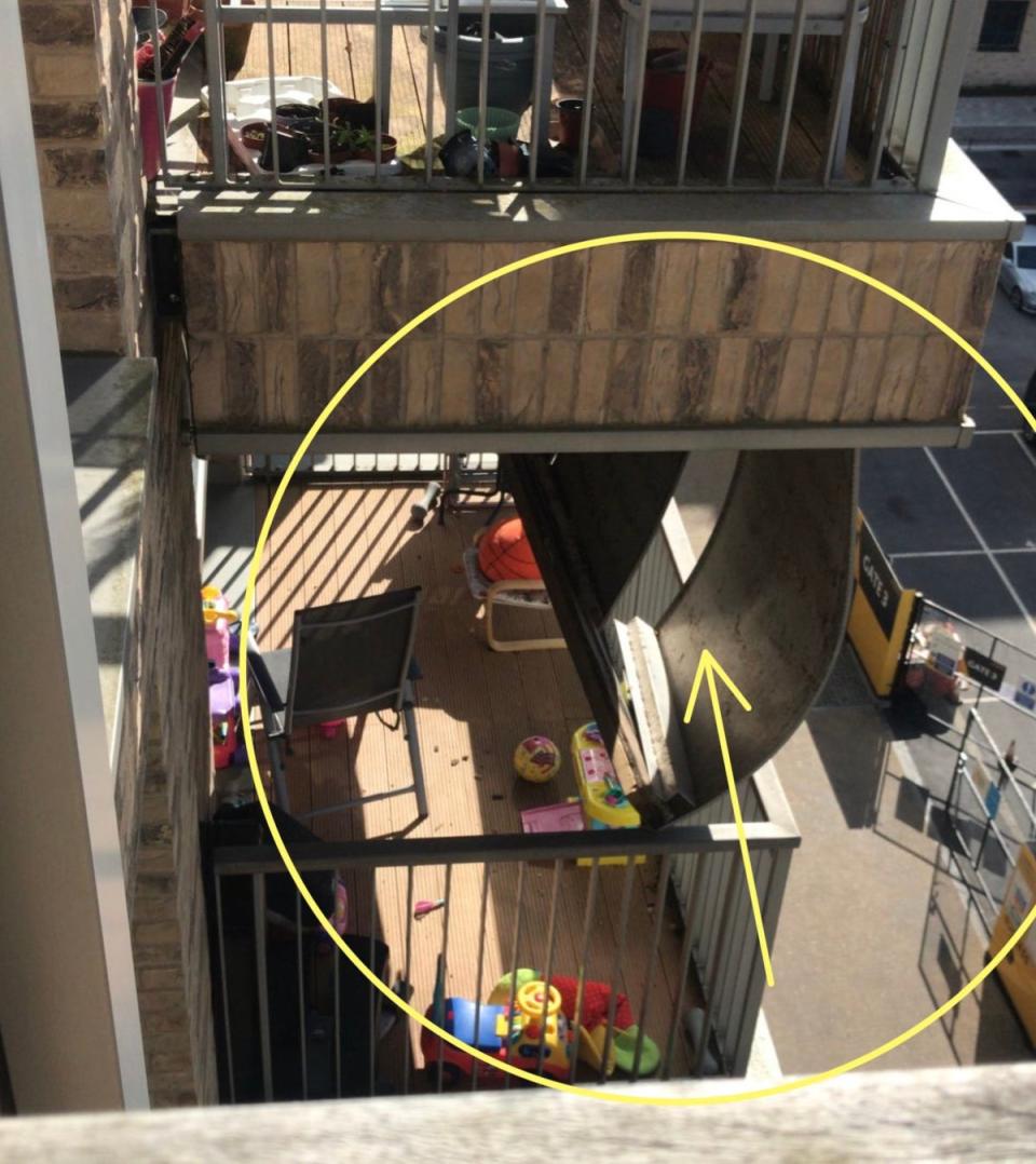 Matt  Lismore reported a balcony had partially collapsed in summer of 2021 -  children’s toys can be seen on the balcony beneath (Matt Lismore)