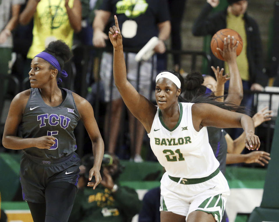 Baylor center Kalani Brown, right, reacts to her score while heading up court with TCU forward Yummy Morris, left, in the first half of an NCAA college basketball game, Saturday, Feb. 9, 2019, in Waco, Texas. (AP Photo/Rod Aydelotte)