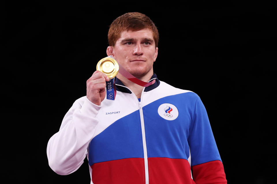 Musa Evloev of Team ROC poses with the gold medal