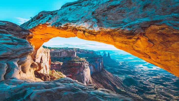 <span class="article__caption">Sunrise at Mesa Arch, Canyonlands National Park </span> (Photo: Tobiasjo/Getty)