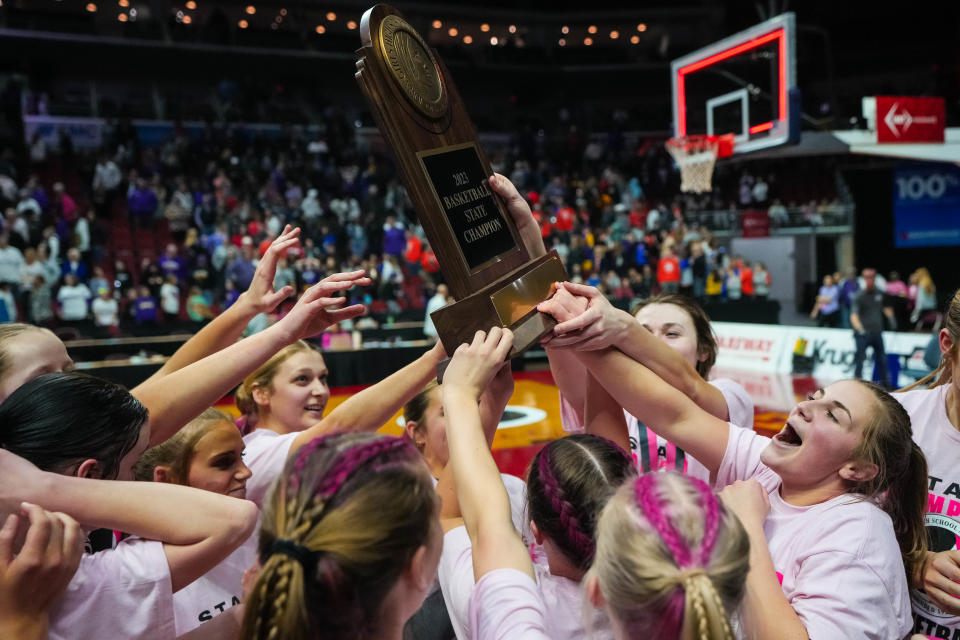 Pleasant Valley celebrates after defeating Johnston to win the Class 5A championship at the 2023 state tournament.