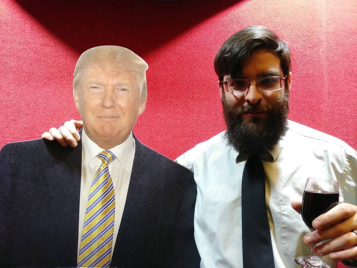 A photo gallery from a 2018 Franklin County, WA Republican dinner shows Taylor Taranto posing with a cutout of Donald Trump. Facial recognition technology used the photo to identify Taranto as being inside the U.S. Capitol during the Jan. 6 riot, according to the HuffPost.com.