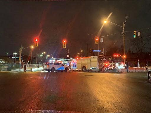 Emergency vehicles are shown here in the area of Humber College Boulevard and Highway 27. A driver has been arrested in Etobicoke Wednesday evening, with the incident involving an injured woman, two fail-to-remain collisions and an injured police officer, Toronto police say.  (Kirthana Sasitharan/CBC - image credit)
