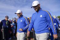Team Europe's Sergio Garcia and Team Europe's Jon Rahm make their way to the seventh hole during a foursome match the Ryder Cup at the Whistling Straits Golf Course Friday, Sept. 24, 2021, in Sheboygan, Wis. (AP Photo/Ashley Landis)