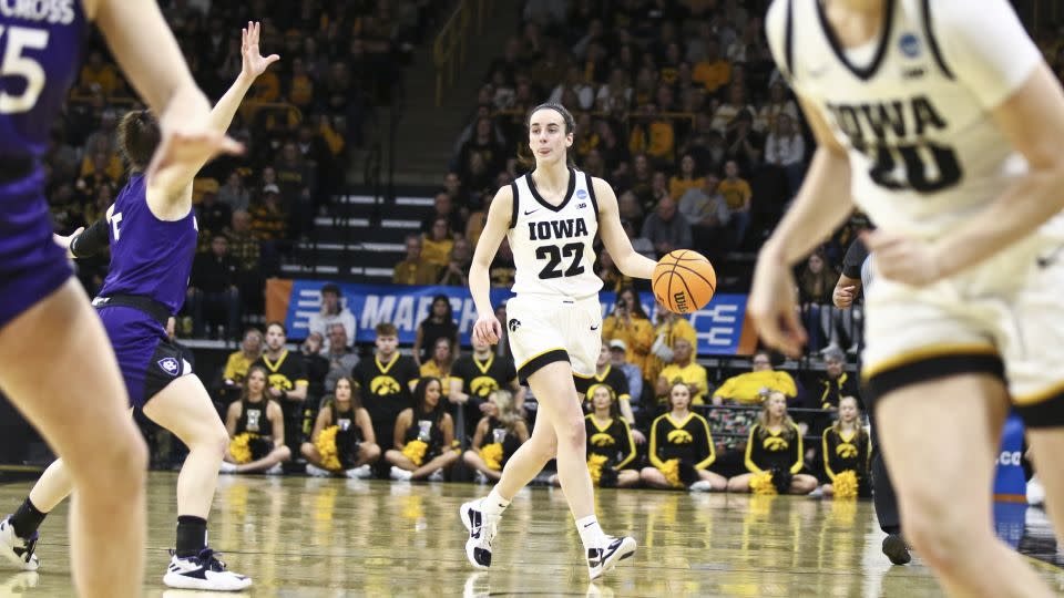 Clark brings the ball down the court during the first half of Iowa's match against the Holy Cross Crusaders at March Madness. - Matthew Holst/Getty Images