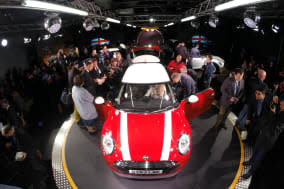 File photo dated 18/11/13 of the new BMW Mini being unveiled at their plant in Oxford. The new Mini is to be built in Holland as well as the UK, owner BMW has announced. PRESS ASSOCIATION Photo. Issue date: Monday February 17, 2014. The German motor giant said production of the Mini Hatch will be split between its factory in Oxford and a site in Nedcar in Born. Around 1,500 workers will build the new Mini in Holland from this summer at a factory run by BMW's Dutch partner VDL Nedcar. See PA story INDUSTRY Mini. Photo credit should read: Steve Parsons/PA Wire