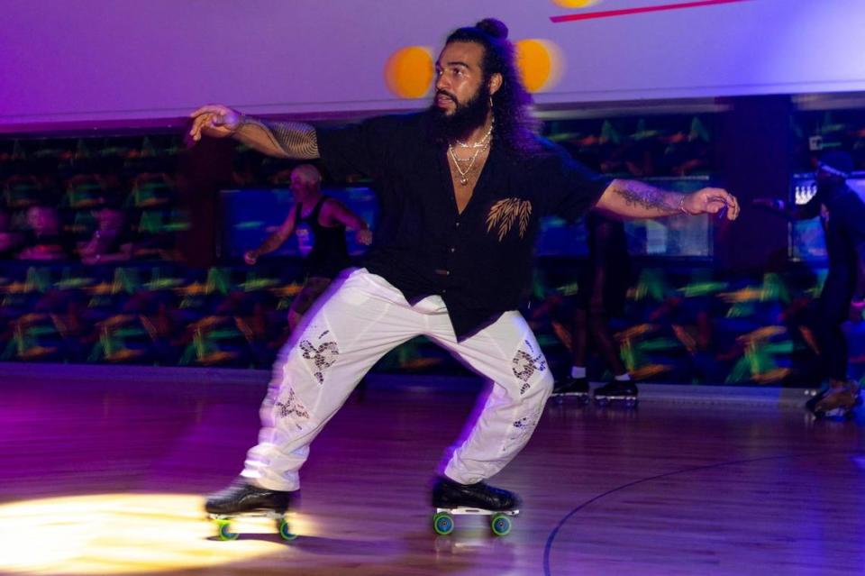 Miami artist Rey Jaffet skates aroud the roller rink during a skating party to mark the official closing of Super Wheels in Miami, Florida, on Saturday, November 25, 2023.