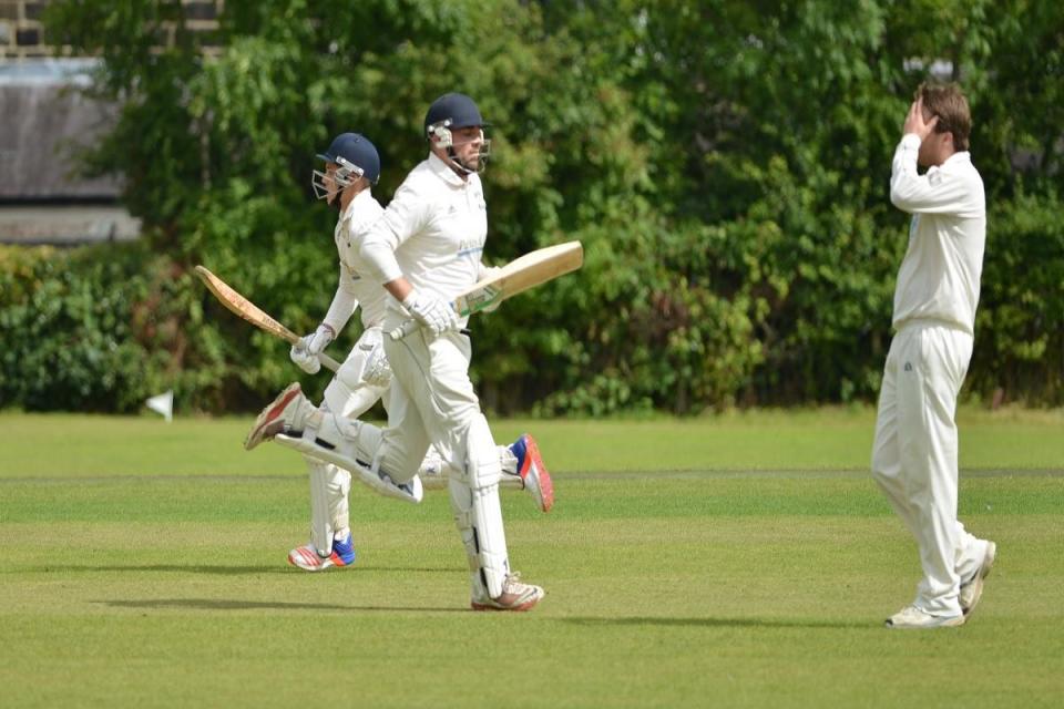 Otley's Josh Atkinson, left, scored 58 for his side