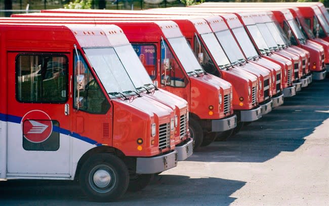 Canada Post vehicles sit outside a sorting depot in the Ville St-Laurent borough of Montreal, on June 6, 2011. THE CANADIAN PRESS/Graham Hughes