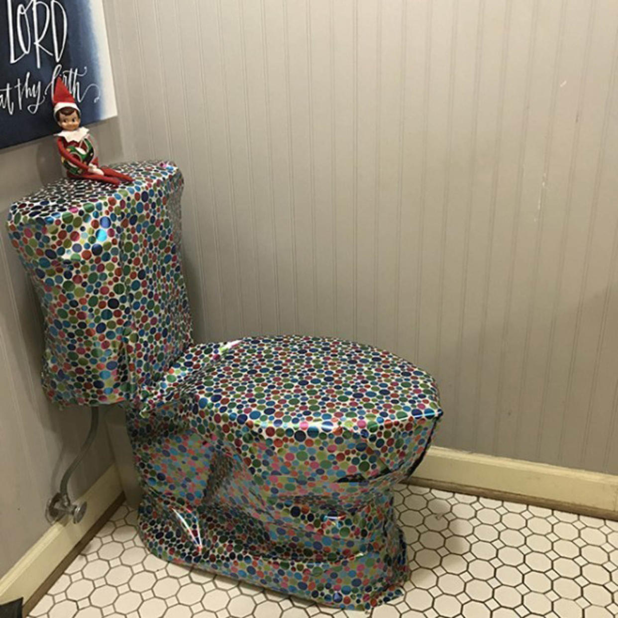 elf on the shelf on gift-wrapped toilet (Courtesy Jessica N. Turner)