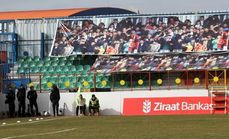 Turkish riot police stand in front of the emty tribune of the Seyrantepe DISKI stadium before the Turkish Cup quarter final first leg soccer match between Amedspor and Fenerbahce in the Kurdish-dominated southeastern city of Diyarbakir, Turkey February 9, 2016. REUTERS/Sertac Kayar