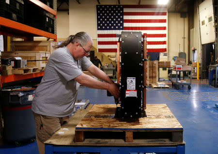 Receiving and shipping worker Mike Pawloski prepares to ship a newly assembled transformer to a client in the RoMan Manufacturing plant in Grand Rapids, Michigan, U.S. December 12, 2018. Picture taken December 12, 2018. REUTERS/Rebecca Cook