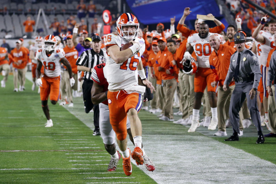 FILE - Clemson quarterback Trevor Lawrence runs for a touchdown against Ohio State during the first half of the Fiesta Bowl NCAA college football playoff semifinal in Glendale, Ariz., Saturday, Dec. 28, 2019, in Glendale, Ariz. Lawrence is widely considered the best quarterback prospect to come out of college since Andrew Luck nearly a decade ago. (AP Photo/Ross D. Franklin)