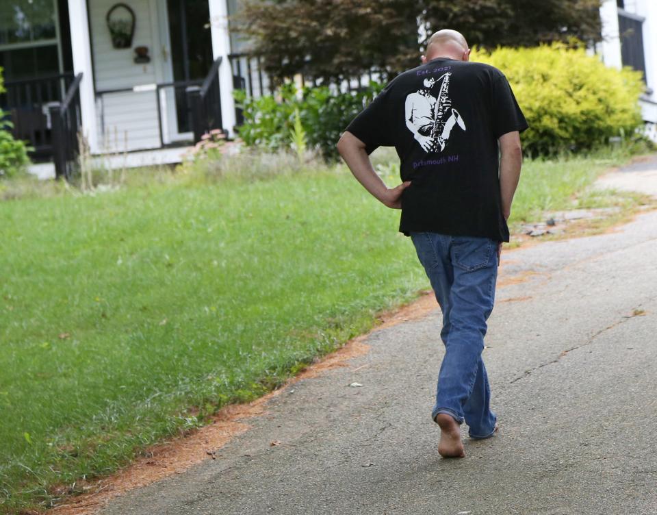 Gavin Sorge Sr. of South Berwick, Maine, walks slowly back to his home Wednesday, Sept. 7, 2022 after speaking about the loss of his son and two other family members in a recent motor vehicle accident.