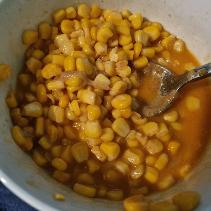 corn kernels in a reddish liquid
