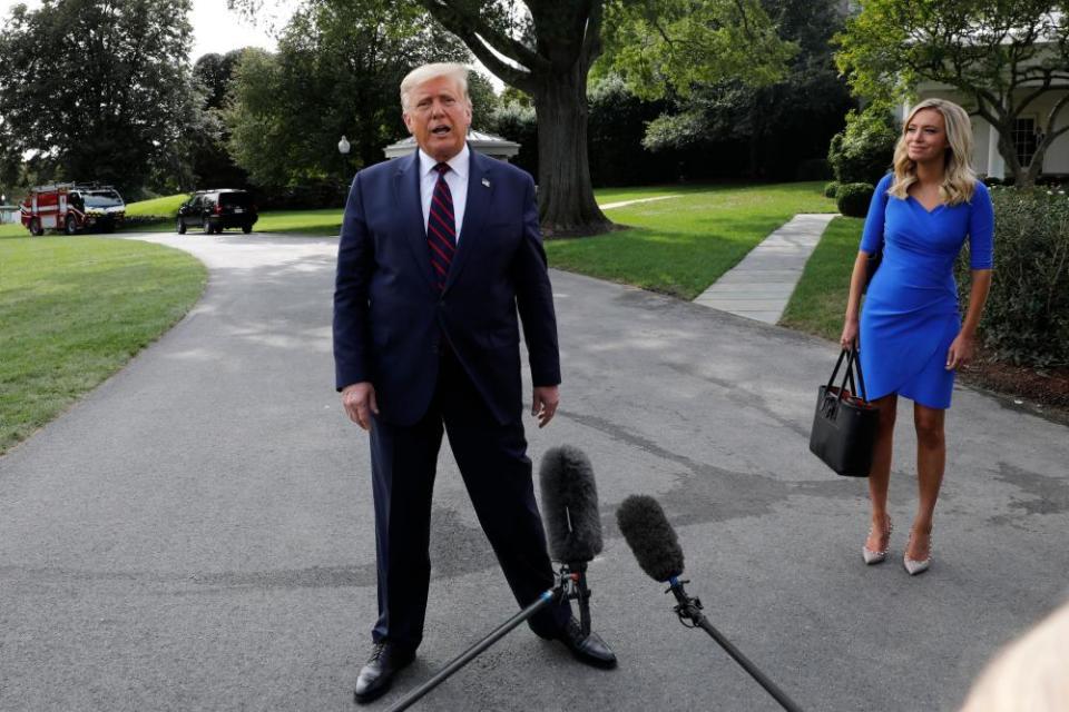 Donald Trump with spokeswoman Kayleigh McEnany before his departure for Philadelphia.