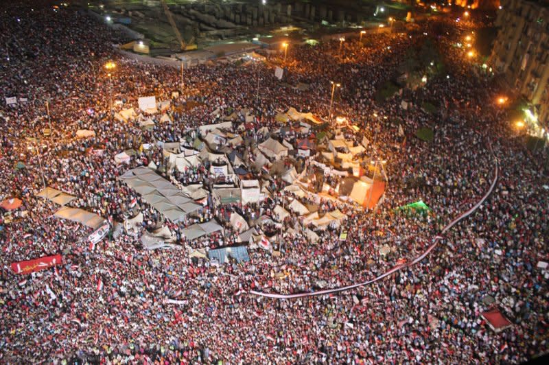 Shouts of joy emanate from Tahrir Square after a broadcast by the head of the Egyptian military confirming that they would temporarily be taking over leadership after removing the country's first democratically elected president, Mohamed Morsi, from power, on July 3, 2013, in Cairo, Egypt. File Photo by Ahmed Jomaa/UPI