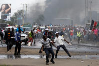 <p>Supporters of Kenyan opposition leader Raila Odinga throw stones at police in Nairobi, Kenya, Nov. 17, 2017. (Photo: Thomas Mukoya/Reuters) </p>