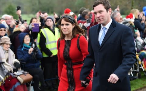 Princess Eugenie of York and her husband Jack Brooksbank arrive for the Royal Family's traditional Christmas Day service  - Credit: AFP