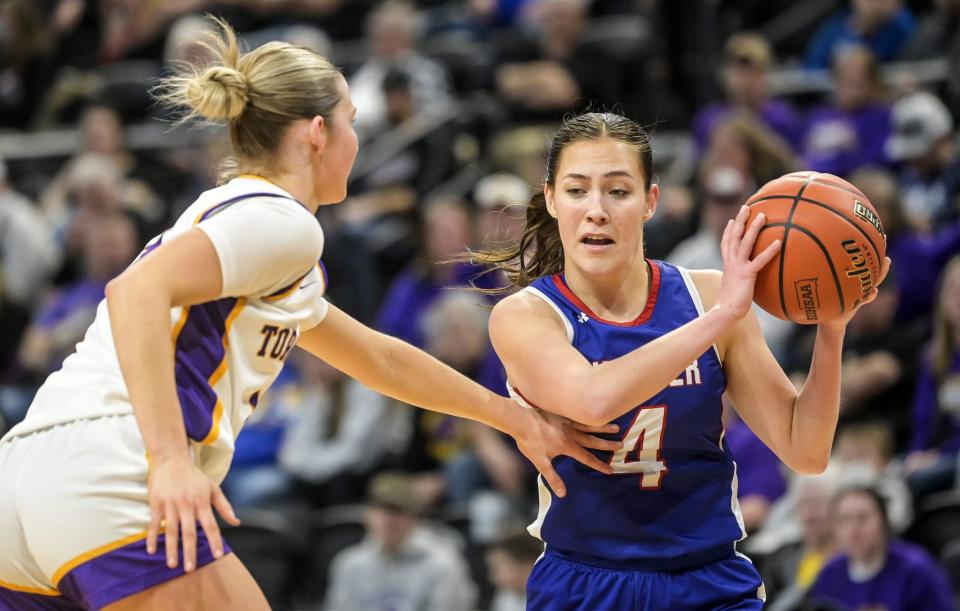 Warner's Kyra Marcuson (4) makes a move to the basket as Centerville's Althea Gust (3) defends during their first-round game in the state Class B girls basketball tournament on Thursday, Feb. 7, 2024 in the Summit Arena at the Momument in Rapid City.