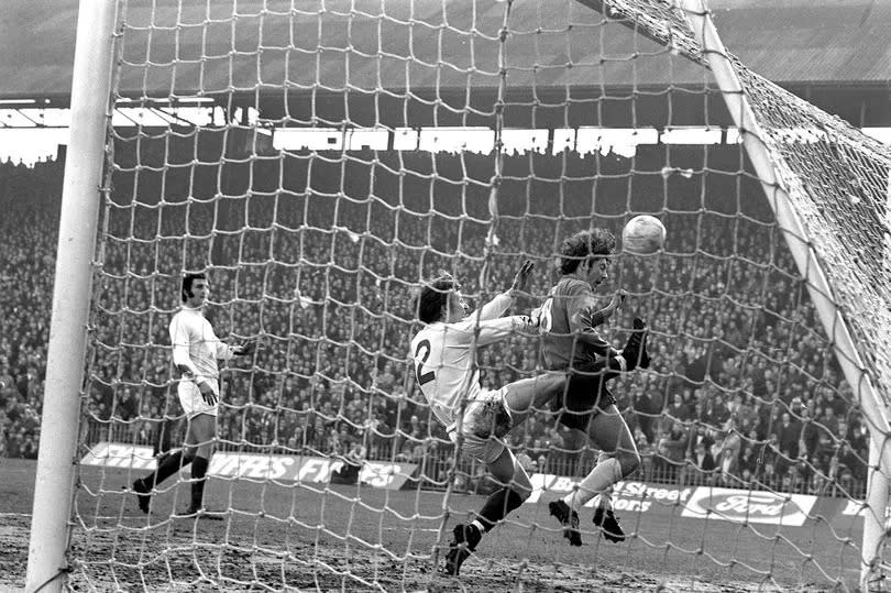 Birmingham City v Bolton Wanderers in 1971.
Trevor Francis heads in the first goal despite a desperate tackle by full-back John Ritson.