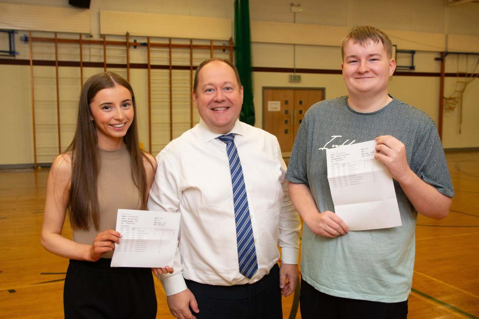 Katie Adams and Matthew McMullan celebrate their results with Principal Mr Houston. (Photo: Contributed)