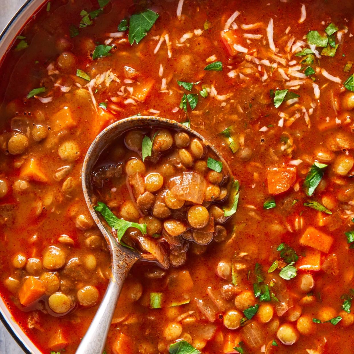 lentil soup garnished with parmesan and parsley